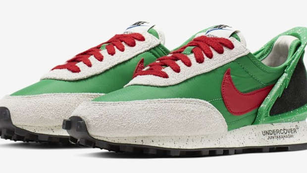 Side view of green, red, and black Nike sneakers.